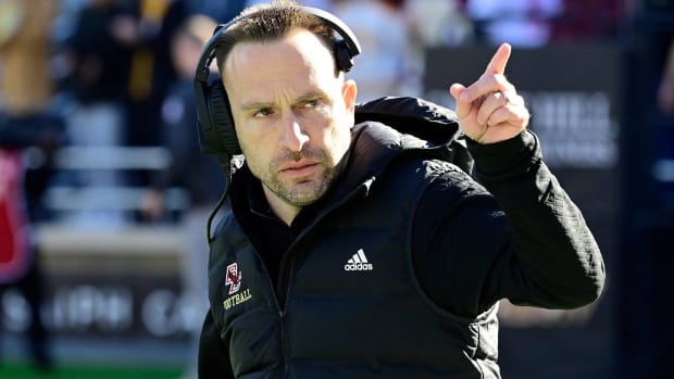 Boston College head coach Jeff Hafley points up during a game.